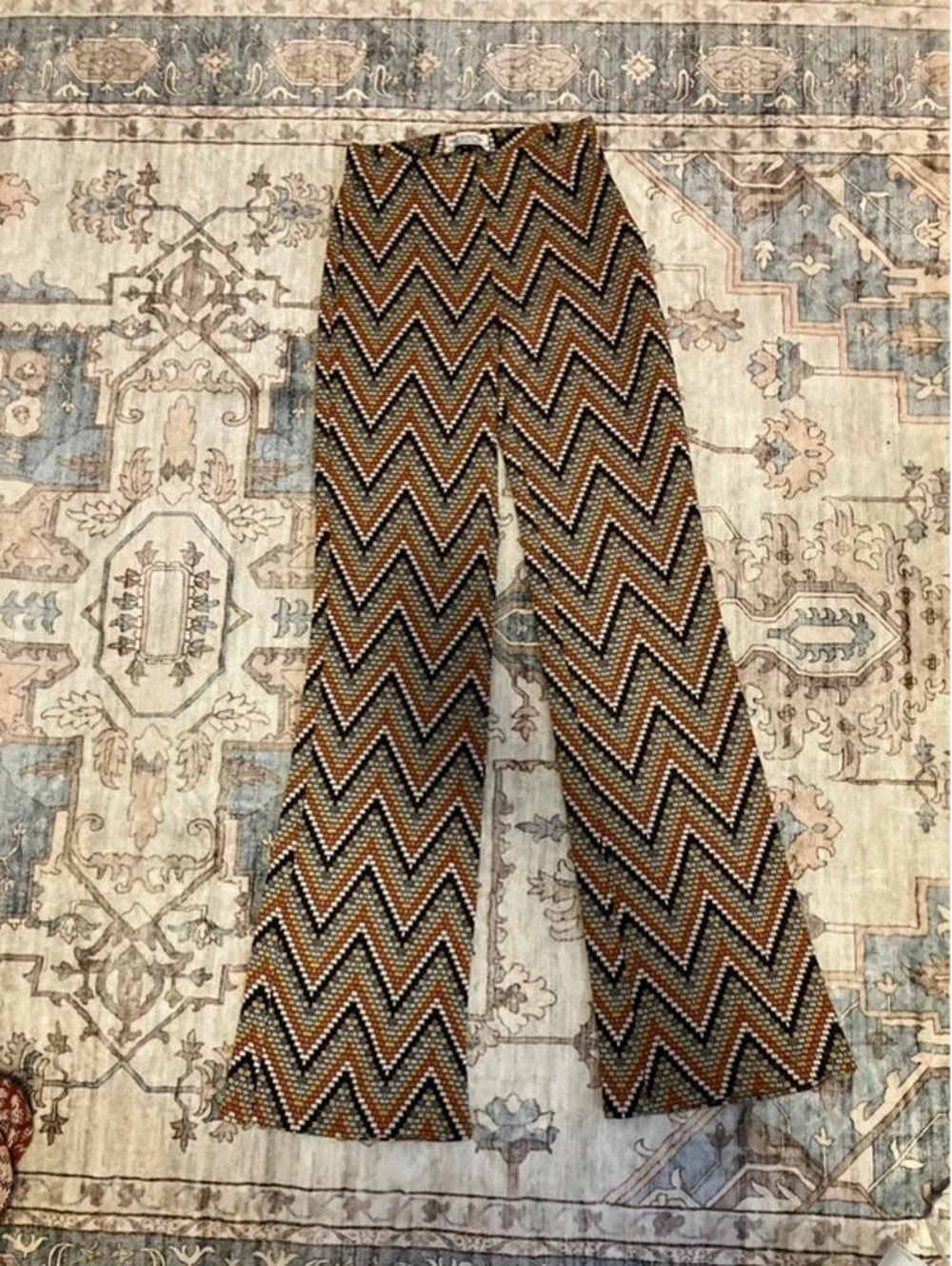 Urban Outfitters women's flare pants in size S, rust, cream, brown and black.